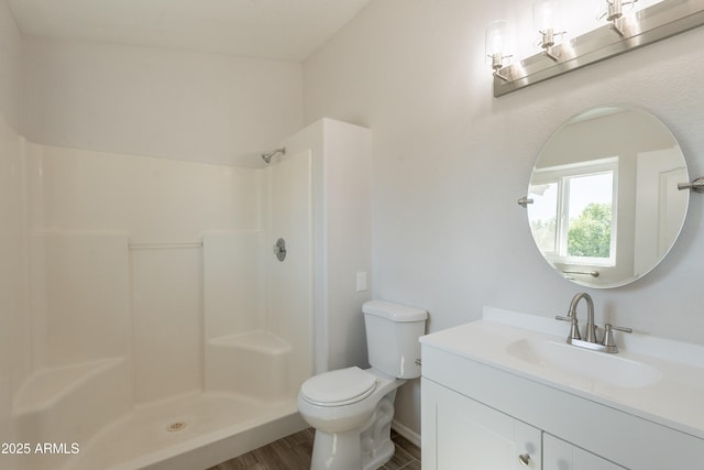 full bath with toilet, baseboards, walk in shower, vanity, and wood finished floors