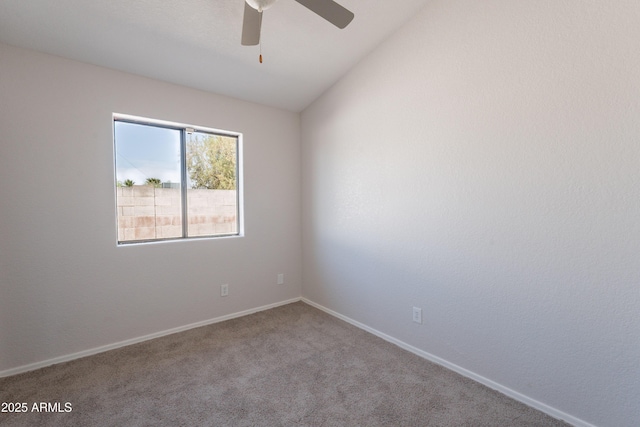 unfurnished room featuring carpet, baseboards, and a ceiling fan