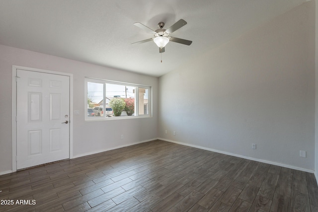 unfurnished room featuring dark wood-style flooring, baseboards, and ceiling fan