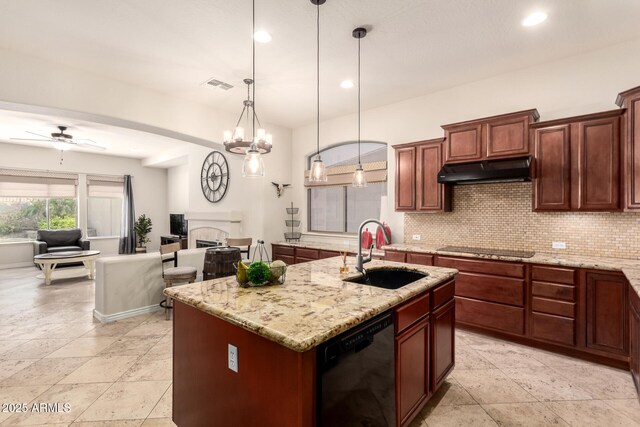 9747 S 182nd Dr, Goodyear, AZ 85338 - kitchen with black appliances, under cabinet range hood, visible vents, decorative backsplash, and a sink