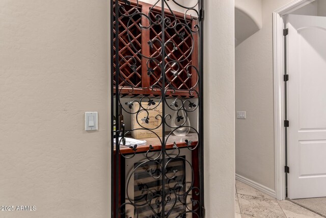 9747 S 182nd Dr, Goodyear, AZ 85338 - wine cellar featuring a textured wall and baseboards
