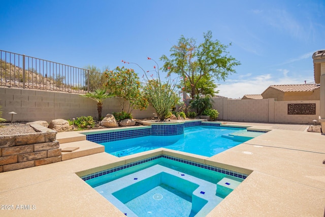 9747 S 182nd Dr, Goodyear, AZ 85338 - view of pool featuring a fenced backyard, an in ground hot tub, and a fenced in pool