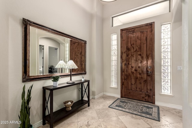9747 S 182nd Dr, Goodyear, AZ 85338 - foyer entrance featuring a healthy amount of sunlight and baseboards