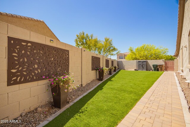 9747 S 182nd Dr, Goodyear, AZ 85338 - view of yard with a fenced backyard and a gate