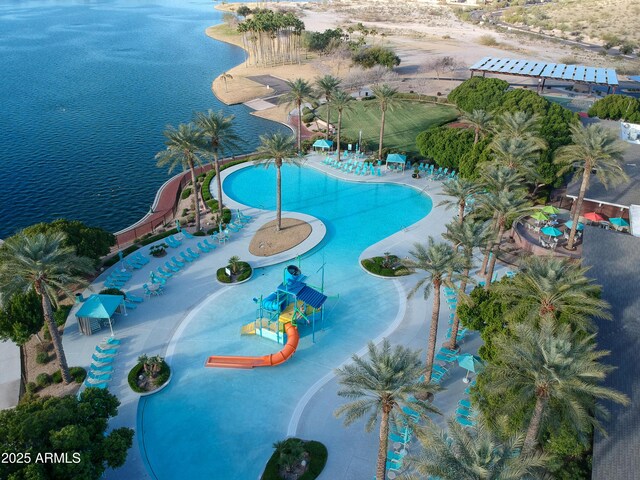9747 S 182nd Dr, Goodyear, AZ 85338 - view of swimming pool featuring a water play area and a water view