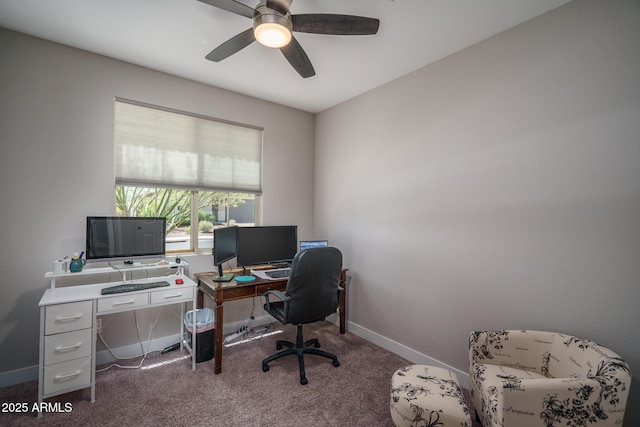 office space featuring carpet flooring, ceiling fan, and baseboards
