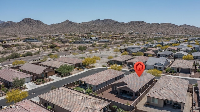 drone / aerial view with a residential view and a mountain view