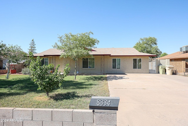 ranch-style house with a front yard