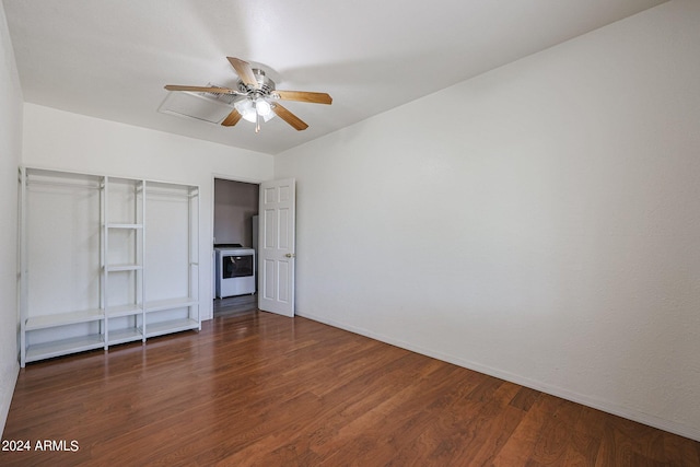 unfurnished bedroom with ceiling fan and dark wood-type flooring