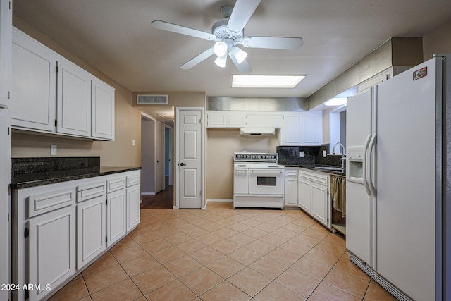 kitchen with light tile patterned floors, sink, white appliances, white cabinetry, and ventilation hood