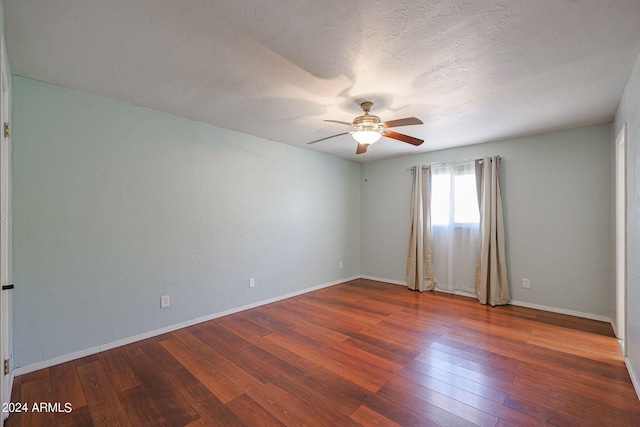 unfurnished room featuring ceiling fan, hardwood / wood-style flooring, and a textured ceiling