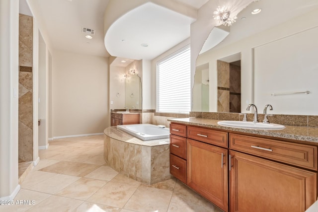 bathroom featuring vanity, tile patterned floors, and plus walk in shower