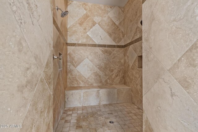 bathroom featuring a tile shower