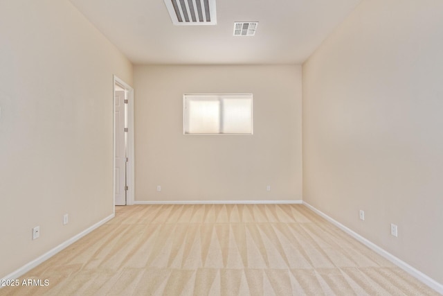 unfurnished room with light carpet