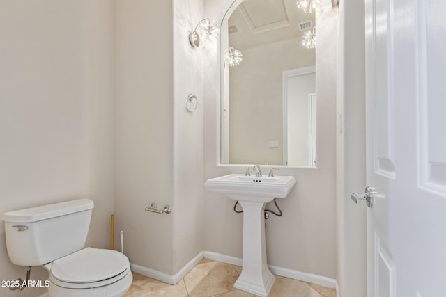 bathroom featuring tile patterned floors and toilet