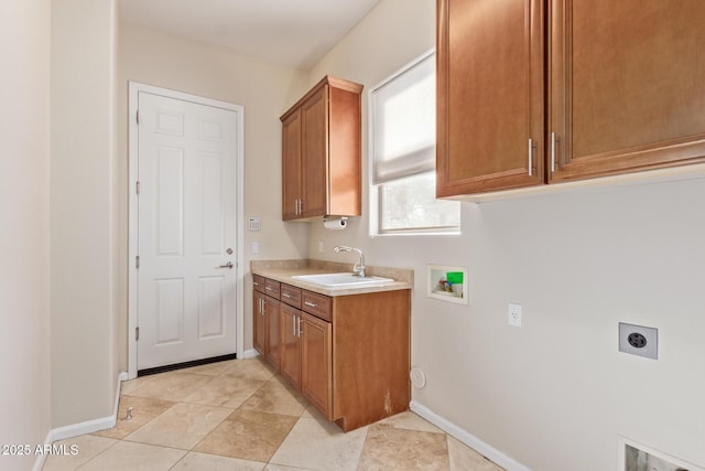 laundry area with sink, cabinets, light tile patterned floors, hookup for a washing machine, and hookup for an electric dryer