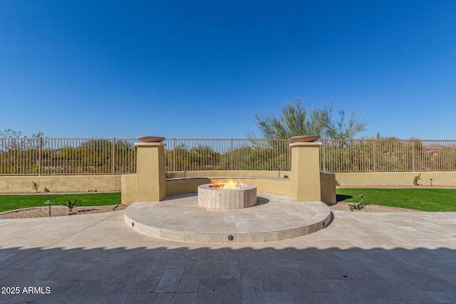 view of patio with an outdoor fire pit