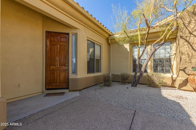 entrance to property with a patio area