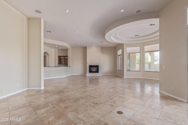 unfurnished living room featuring light tile patterned floors