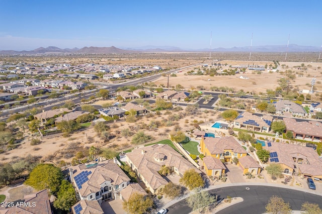 birds eye view of property featuring a mountain view