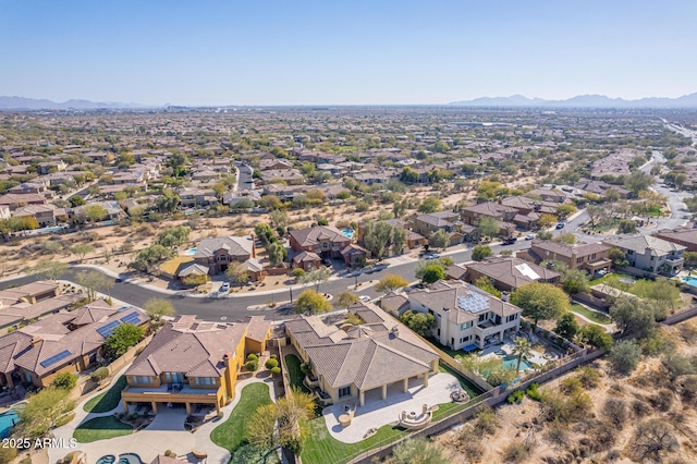 birds eye view of property with a mountain view