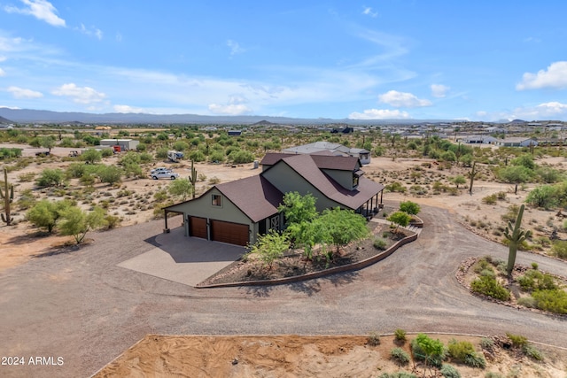 birds eye view of property featuring a mountain view