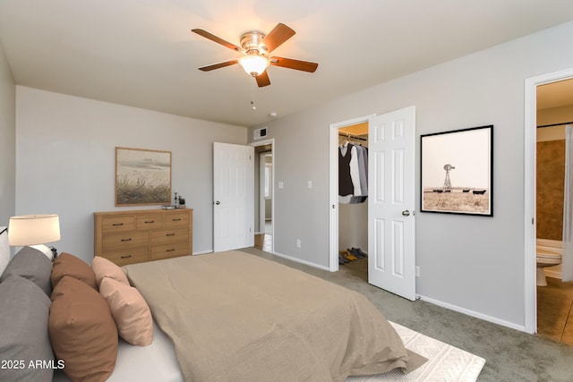 2922 S Cottonwood Dr, Tempe, AZ 85282 - carpeted bedroom with a spacious closet, connected bathroom, baseboards, ceiling fan, and a closet