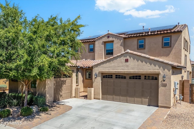 mediterranean / spanish-style home with solar panels