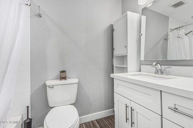 591 N Cheri Lynn Dr, Chandler, AZ 85225 - full bathroom with vanity, wood finished floors, toilet, and baseboards