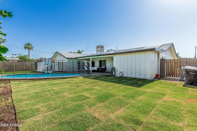 591 N Cheri Lynn Dr, Chandler, AZ 85225 - back of property featuring board and batten siding and a patio area