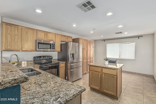 591 N Cheri Lynn Dr, Chandler, AZ 85225 - kitchen featuring stainless steel appliances, light stone counters, light tile patterned floors, and recessed lighting