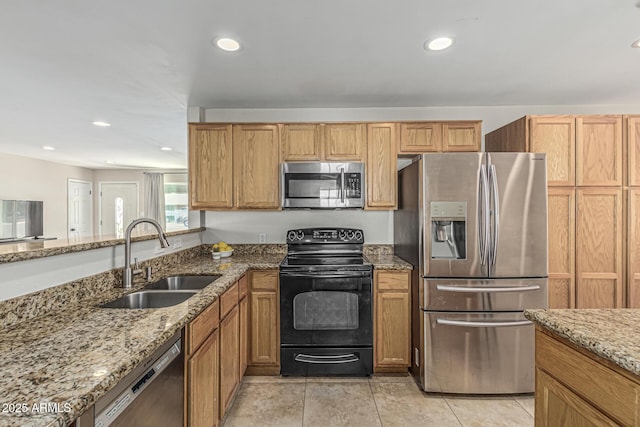 591 N Cheri Lynn Dr, Chandler, AZ 85225 - kitchen with stainless steel appliances, a sink, light stone countertops, and recessed lighting