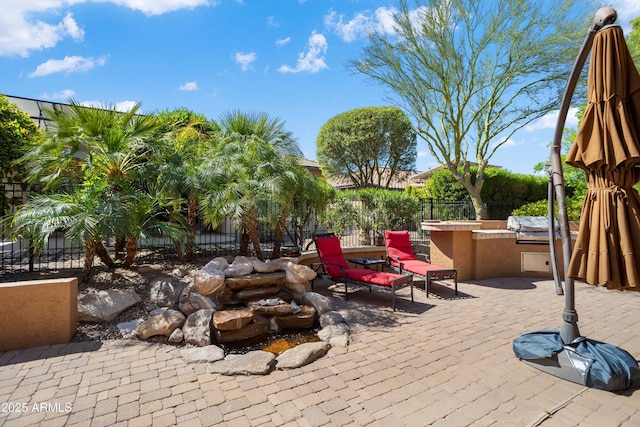 26293 W Runion Ln, Buckeye, AZ 85396 - view of patio with an outdoor kitchen, a fenced backyard, and outdoor dry bar