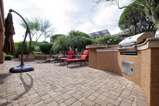 26293 W Runion Ln, Buckeye, AZ 85396 - view of patio / terrace featuring exterior kitchen