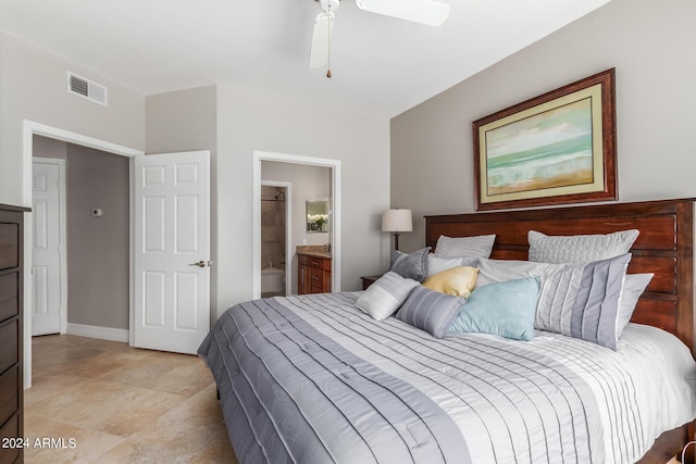 bedroom with ceiling fan and ensuite bath