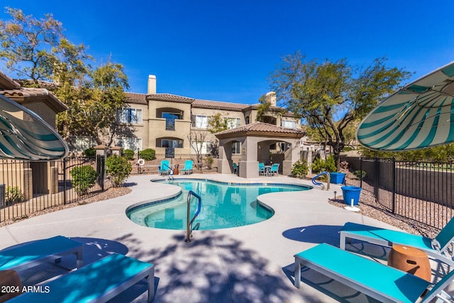 view of swimming pool with a patio area