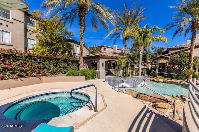 view of pool featuring a community hot tub