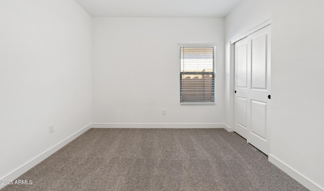 spare room with carpet floors