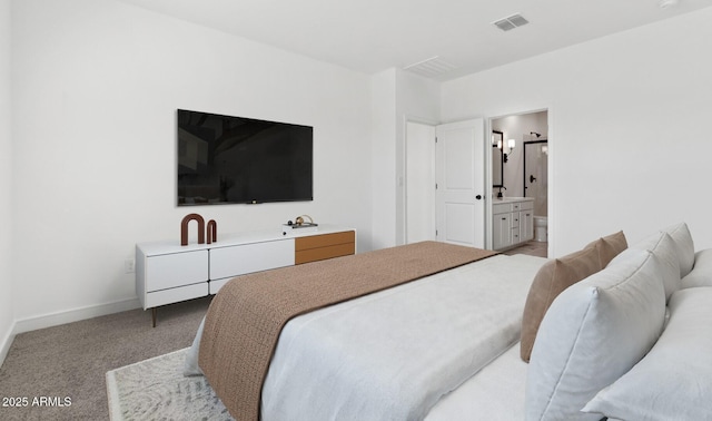 carpeted bedroom with ensuite bathroom