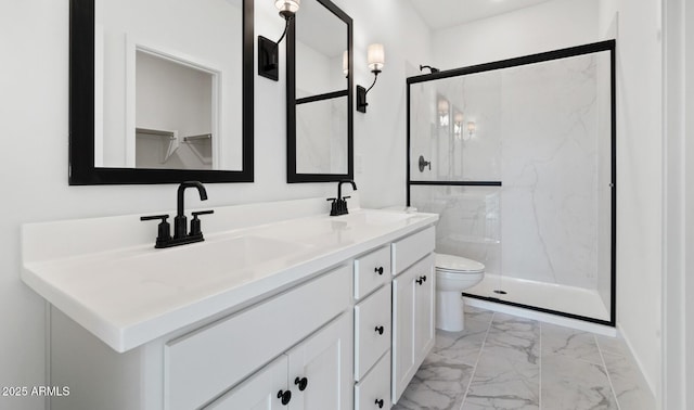 bathroom with toilet, an enclosed shower, and vanity