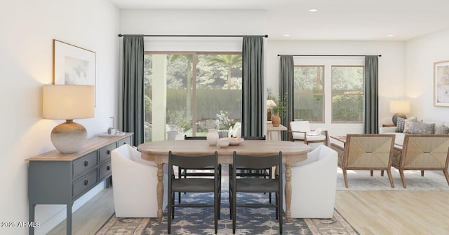 dining area with light hardwood / wood-style floors