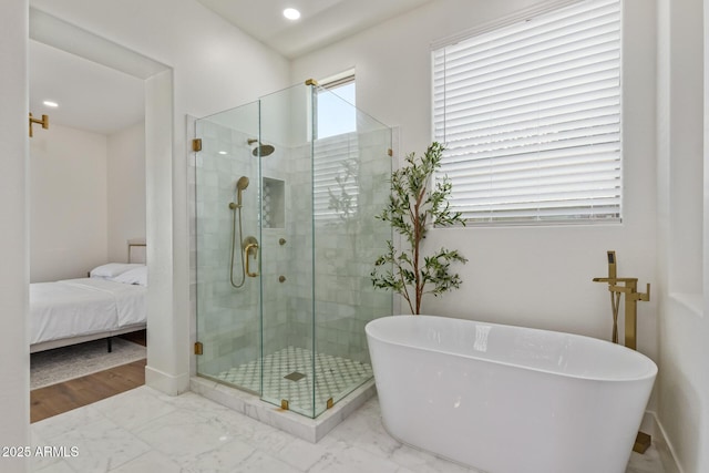 full bathroom featuring a stall shower, a soaking tub, marble look tiles, baseboards, and recessed lighting