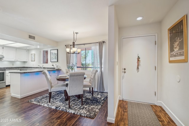 12222 N Paradise Village Pkwy S Unit 442, Phoenix, AZ 85032 - dining room with a chandelier, dark wood-style flooring, recessed lighting, and baseboards