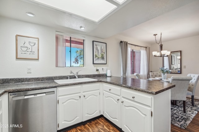12222 N Paradise Village Pkwy S Unit 442, Phoenix, AZ 85032 - kitchen featuring dishwasher, a sink, dark countertops, a chandelier, and dark wood-style floors