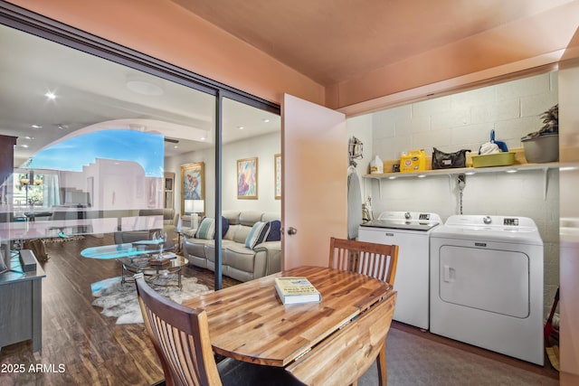 12222 N Paradise Village Pkwy S Unit 442, Phoenix, AZ 85032 - dining area featuring independent washer and dryer, wood finished floors, and concrete block wall