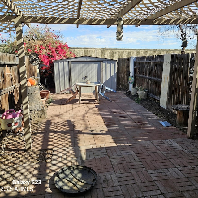 view of patio with a storage shed and a pergola