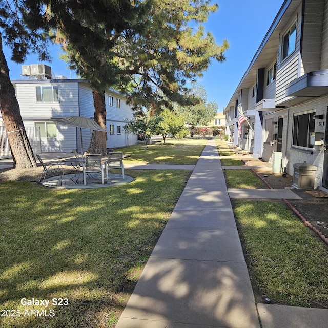 surrounding community featuring a yard