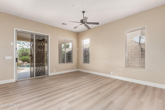 22322 N 77th St, Scottsdale, AZ 85255 - spare room with healthy amount of natural light, light wood-style flooring, and baseboards