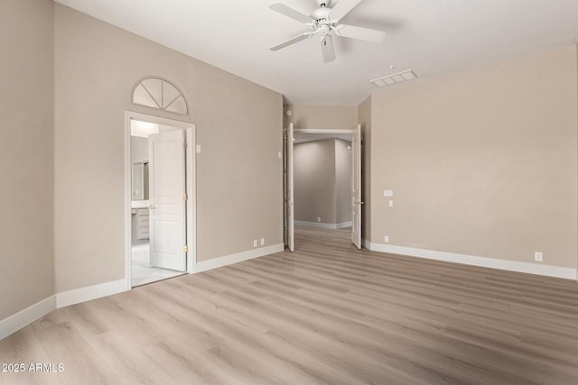 22322 N 77th St, Scottsdale, AZ 85255 - unfurnished bedroom featuring light wood-style flooring, baseboards, ensuite bath, and a ceiling fan