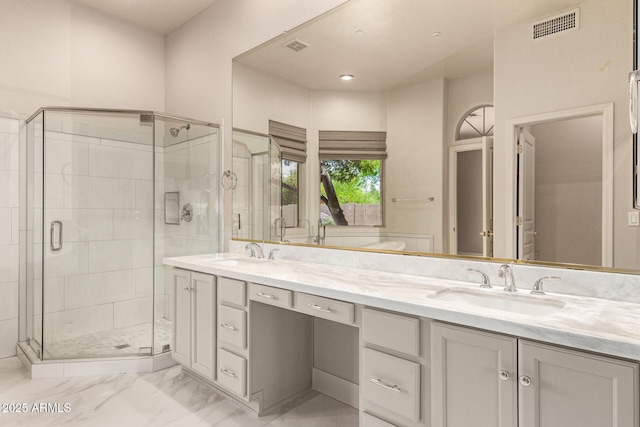 22322 N 77th St, Scottsdale, AZ 85255 - bathroom featuring a shower stall, double vanity, and marble look tiles